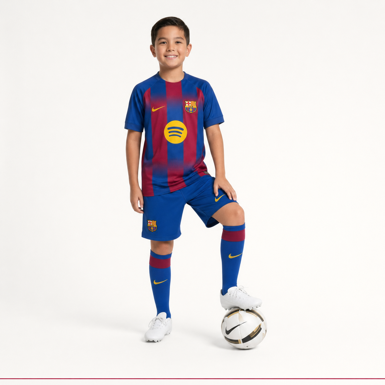 Child model wearing Barcelona 2026 kids football kit