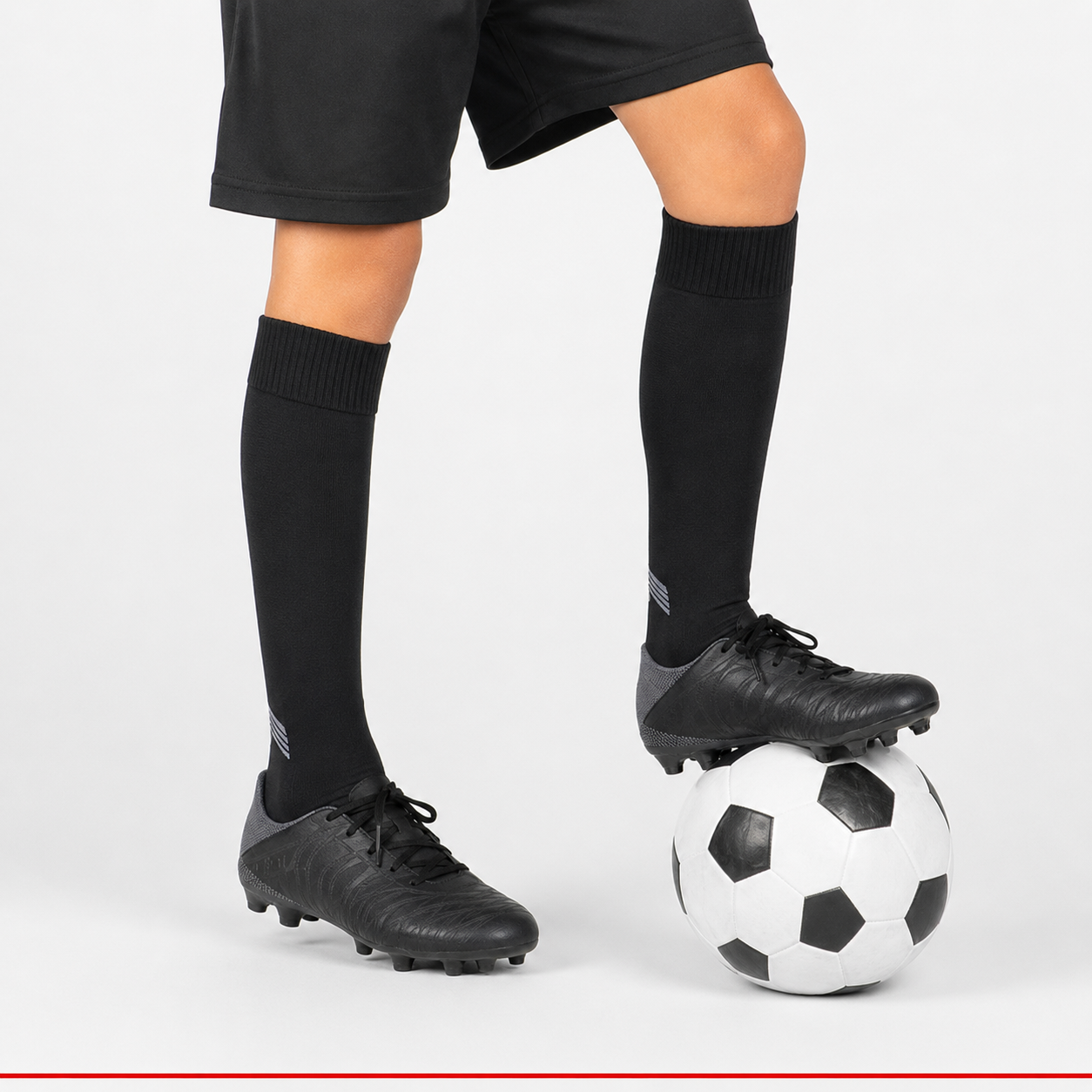 Child football player wearing ProShield black socks