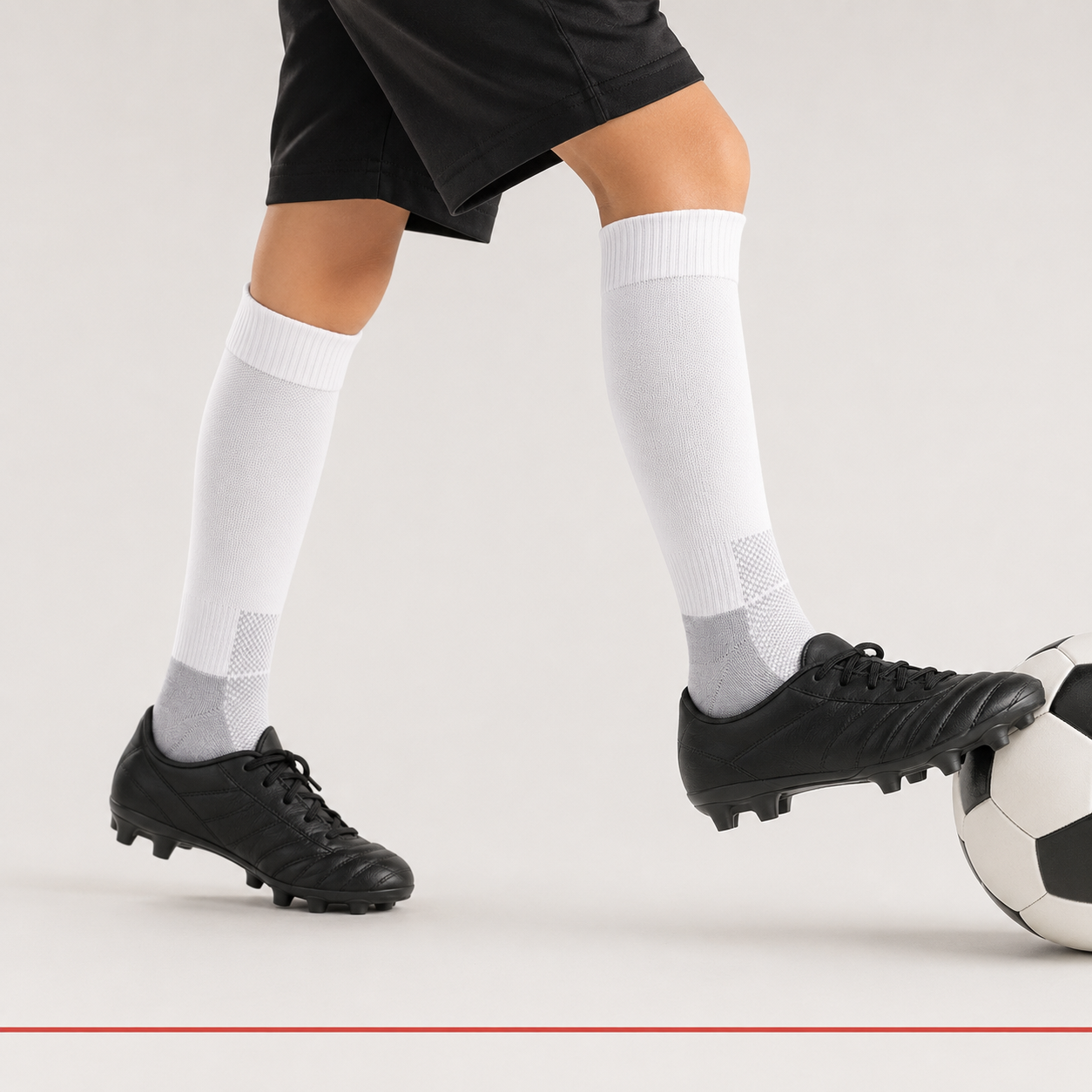 Child football player wearing ProShield white socks