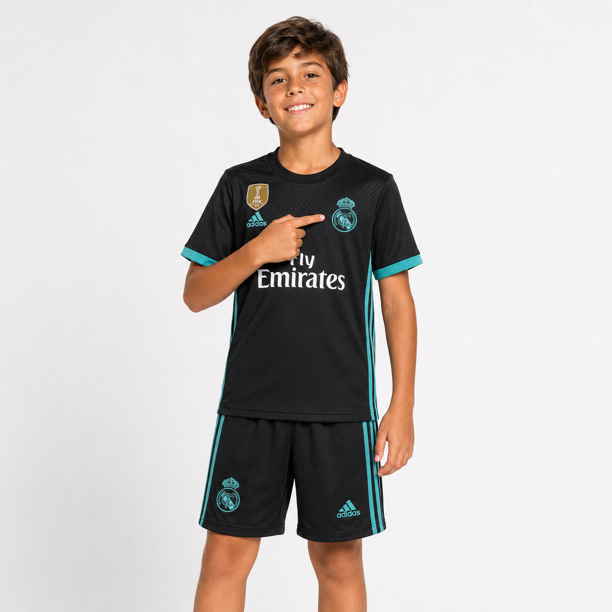 Child model wearing Real Madrid 2017 black kids football kit