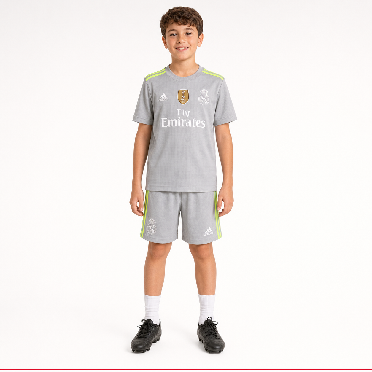 Child model wearing Real Madrid 2018 kids football kit front view
