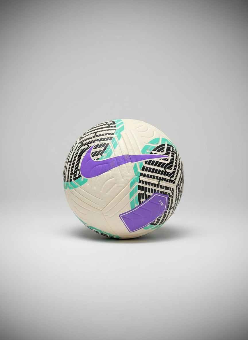 White soccer ball with purple and teal accents on a black background